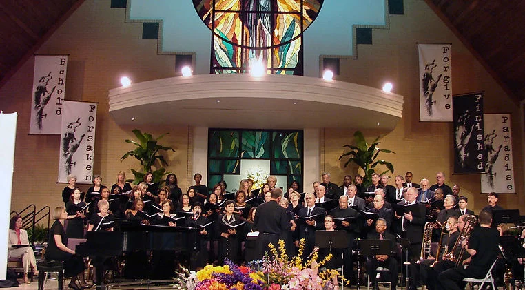 The Forest Lake Church choir and orchestra performing in the sanctuary