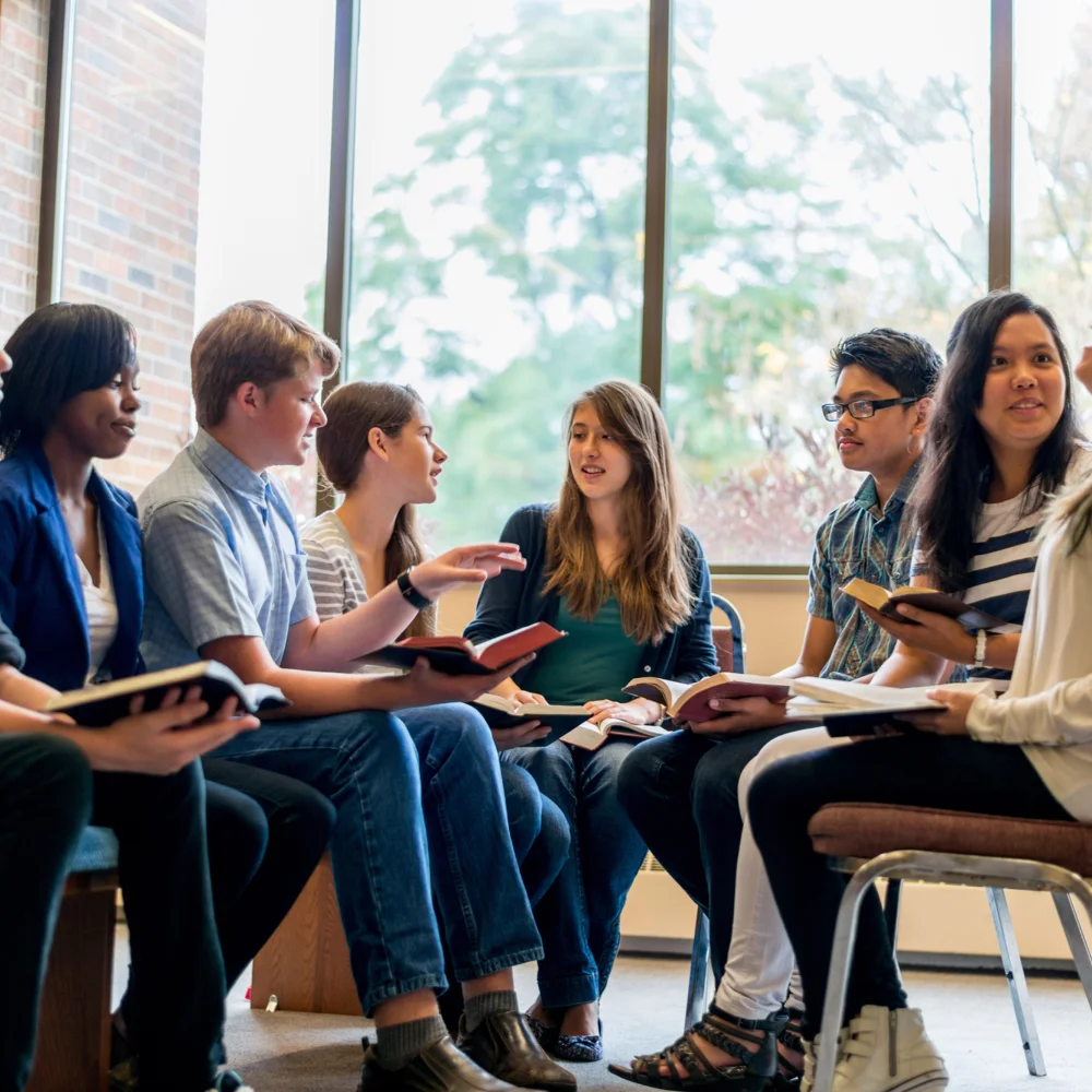 A Sabbath School class studying together in a circle
