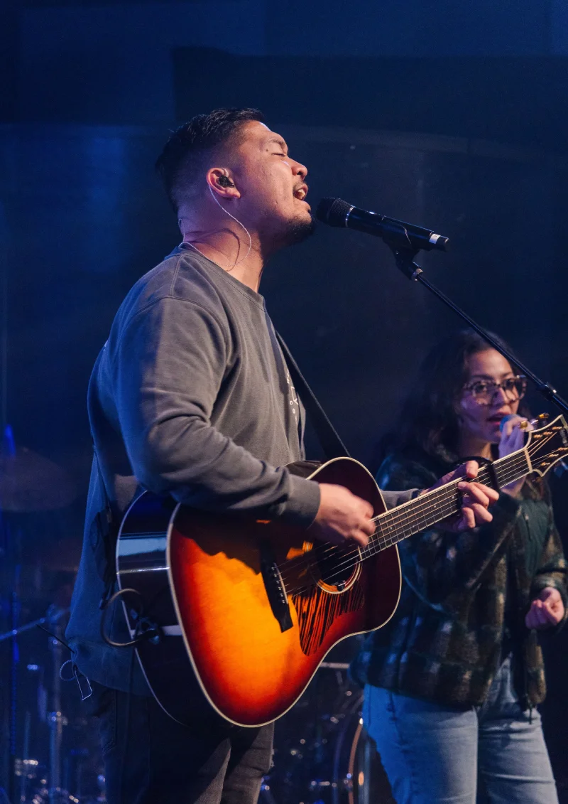 Worship team leading a song during a Warehouse service