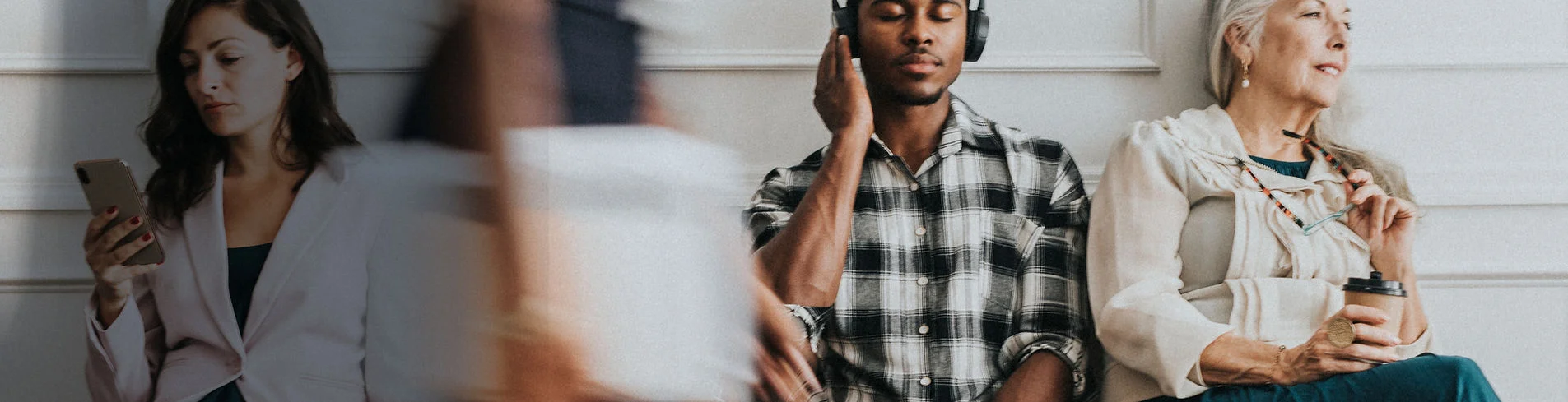 A man listening to a sermon at home with headphones